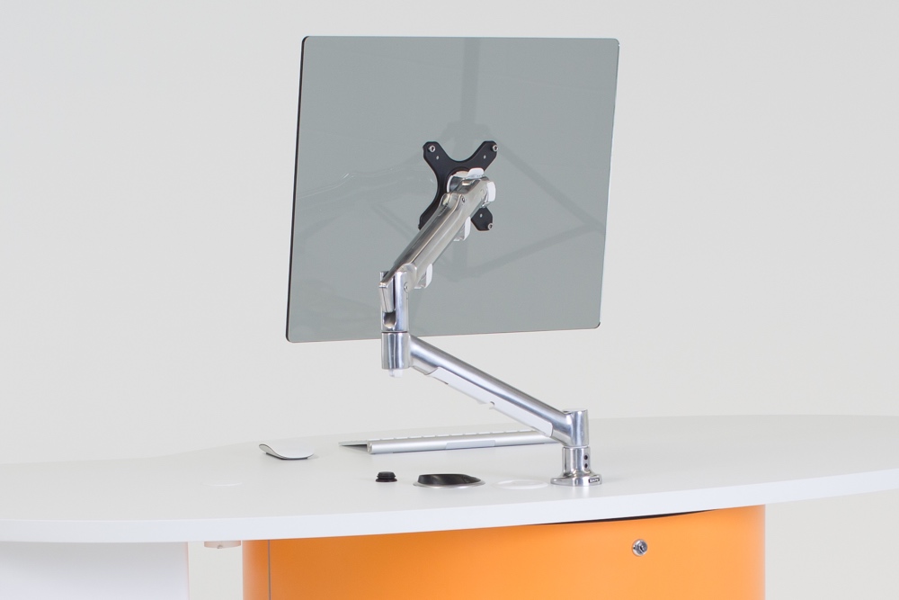 ATDEC Premium Articulated Monitor Arm installed on YAKETY YAK Oval + Drawer 104 desk.