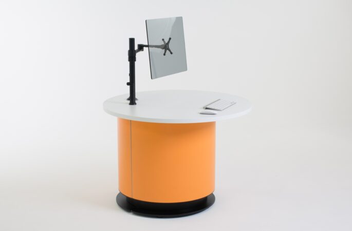Height adjustable YAKETY YAK Round Offset 106 desk lowered to seated height – staff side.