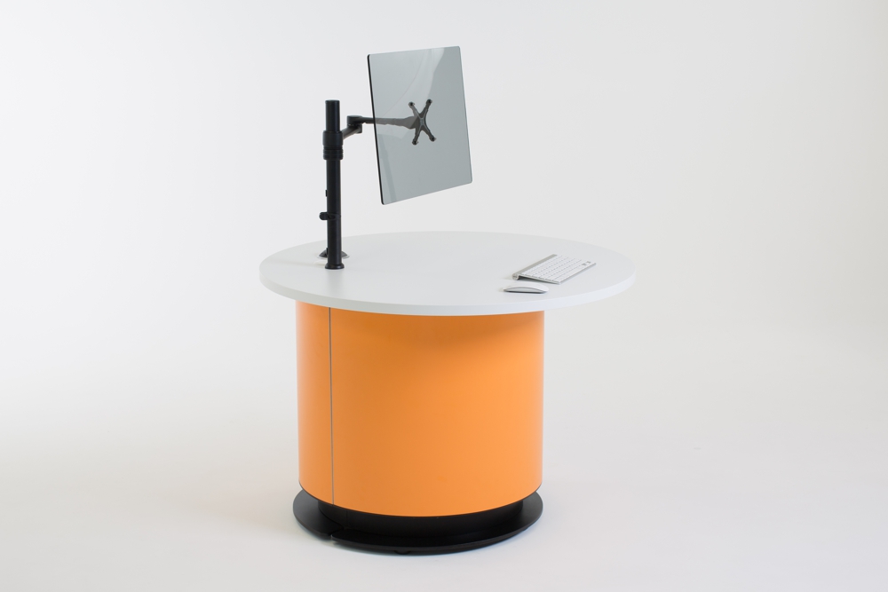 Height adjustable YAKETY YAK Round Offset 106 desk lowered to seated height – staff side.