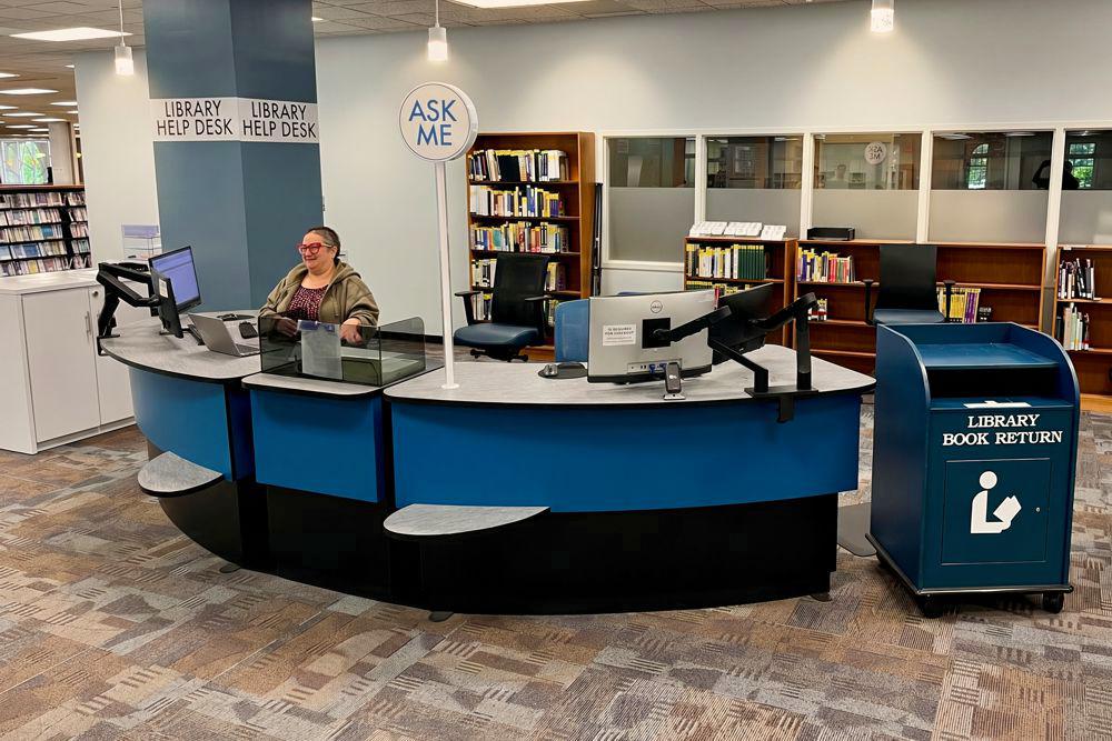 The University of North Carolina main library help desk comprising two YAKETY YAK 305 Radial Counters and a 300 Cash Module.