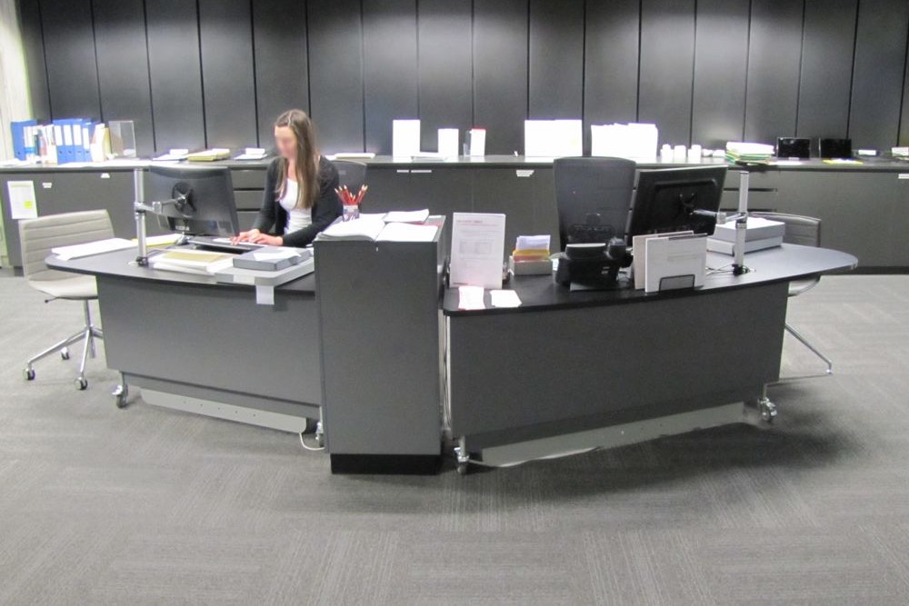 YAKETY YAK 204 and 209 Desks, positioned with a shared storage module in the centre, at The Alexander Turnbull Library.