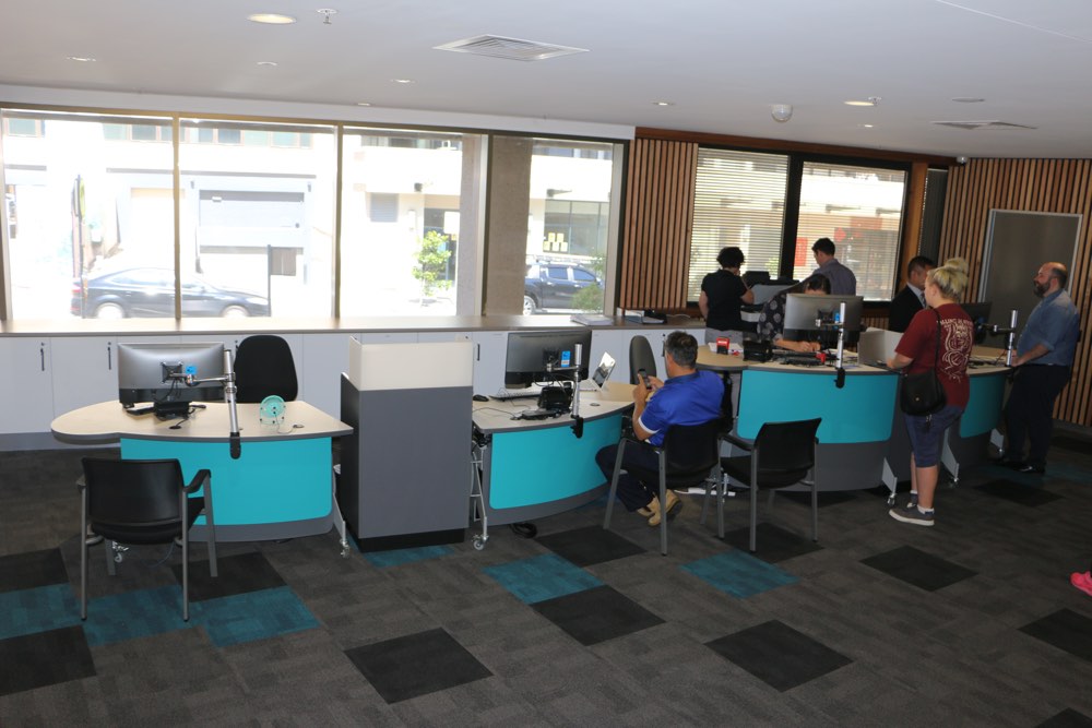 Four YAKETY YAK 202 height-adjustable library Desks in seated and standing positions with our Cash / Eftpos Modules in between, at Georges River Civic Centre.