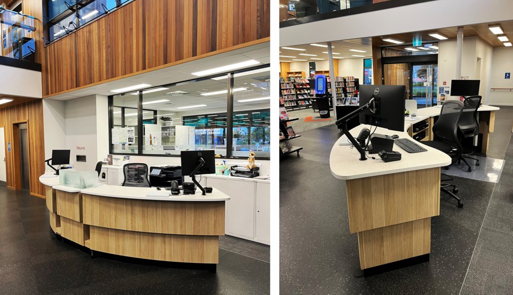 The white and vertical woodgrain finishes on the Picton Library circulation desk mirrors the surrounding interior.