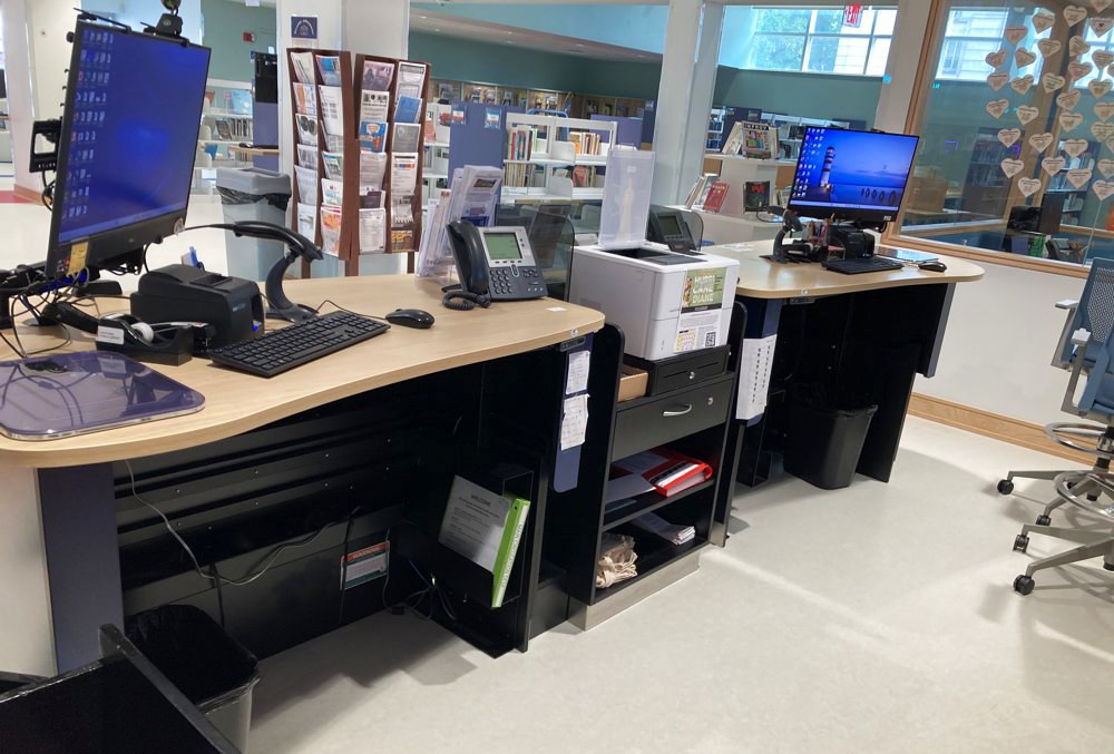 YAKETY YAK 301 and 302 Counters with a central 300 Cash Module create a functional and ergonomic workspace for staff.