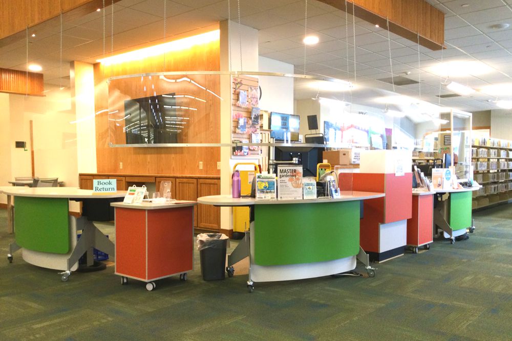 YAKETY YAK 203 height-adjustable library circulation Desks and YAKETY YAK Support Modules form an inviting and dynamic circulation area, at The Public Library for Union County, PA.