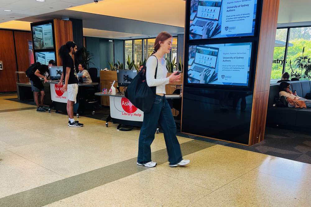 A group of two YAKETY YAK 203 Desks create a welcoming information point for students.