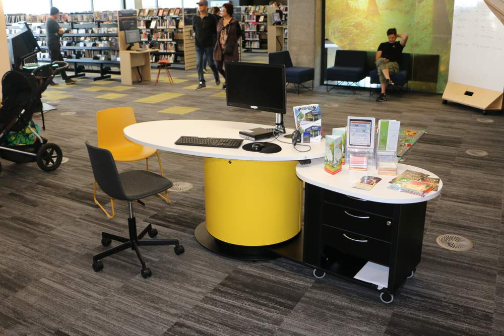 YAKETY YAK Oval 103 (seated position) teamed with YAKETY YAK Support Caddy, positioned in the heart of the library.