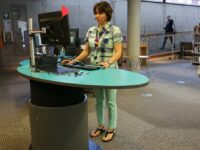 Mona Vale Library staff working at a comfortable standing height on YAKETY YAK Classic Oval’s ergonomic worktop.