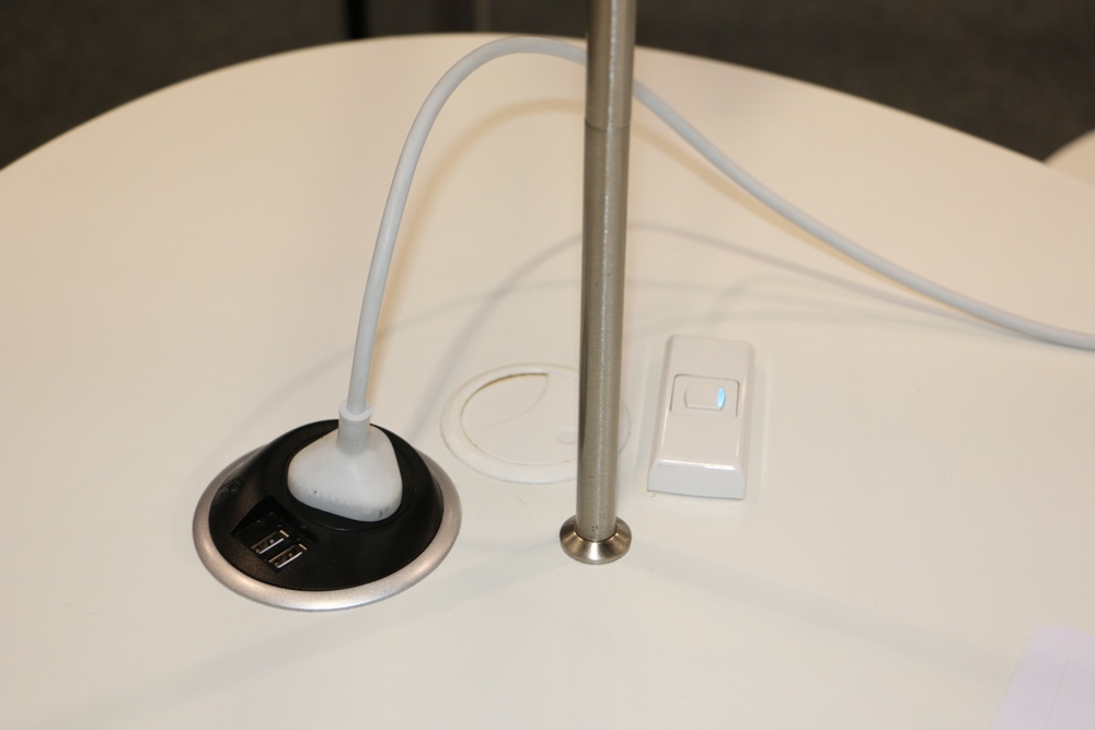 PIXEL Power Button conveniently delivers power and USB outlets to the desktop.