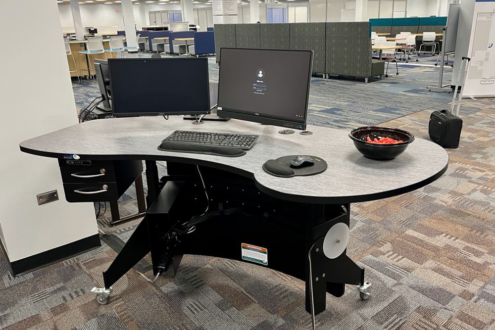 Our YAKETY YAK 203 Desk features built in storage, plenty of leg room and a generous meeting oval for  comfortably working 1:1 with (or sharing treats with) patrons.