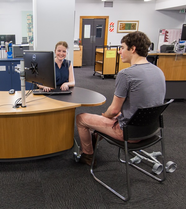 Easy interaction between staff and customer at the meeting end of a YAKETY YAK202 library desk.